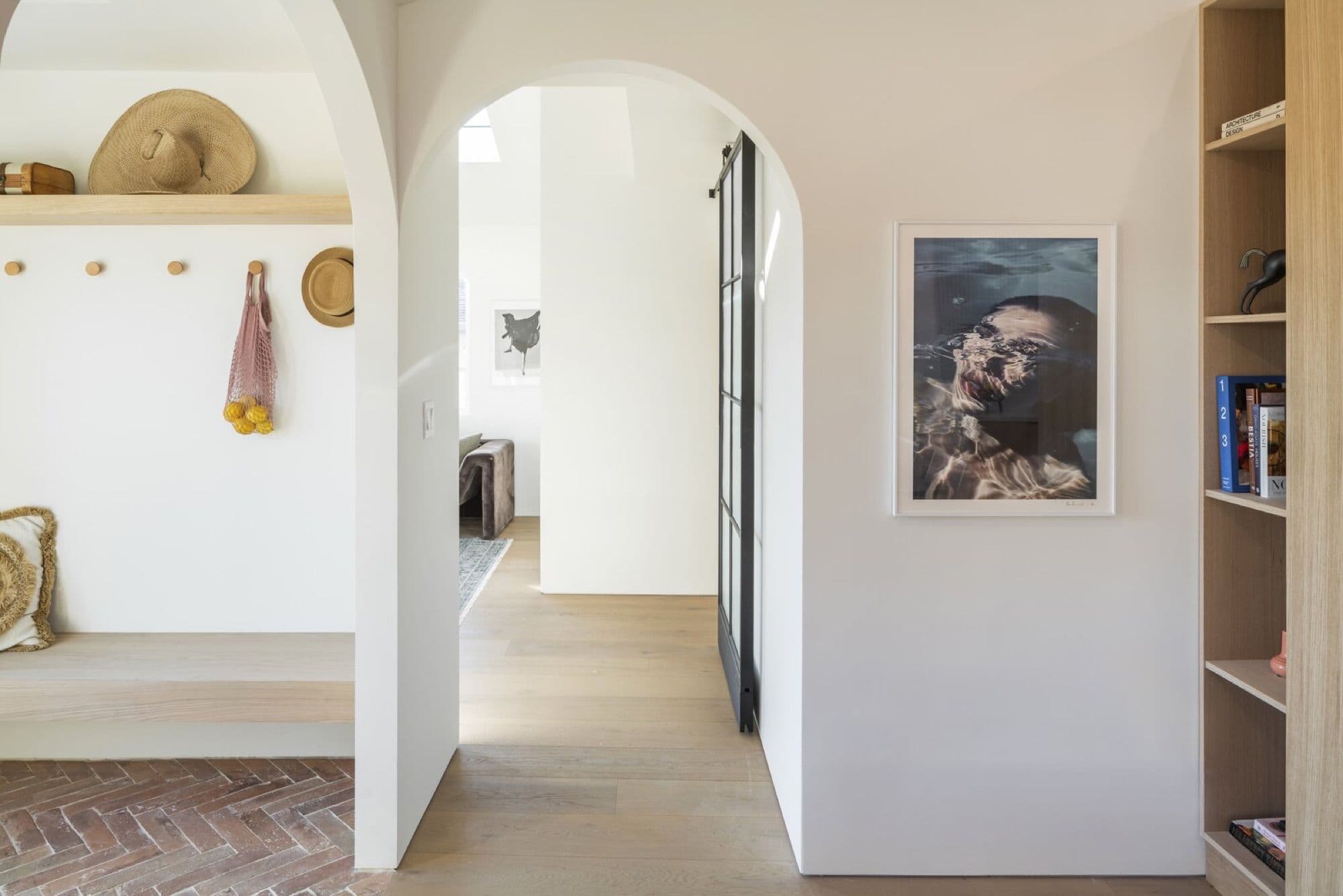 The arch motif was repeated throughout the home at doorways and built-in niches